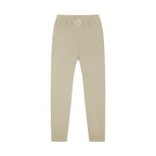 MONROE STORE high-waisted beige yoga leggings with a V-shaped waistband and subtle 'D.A.N.C.E.' logo.