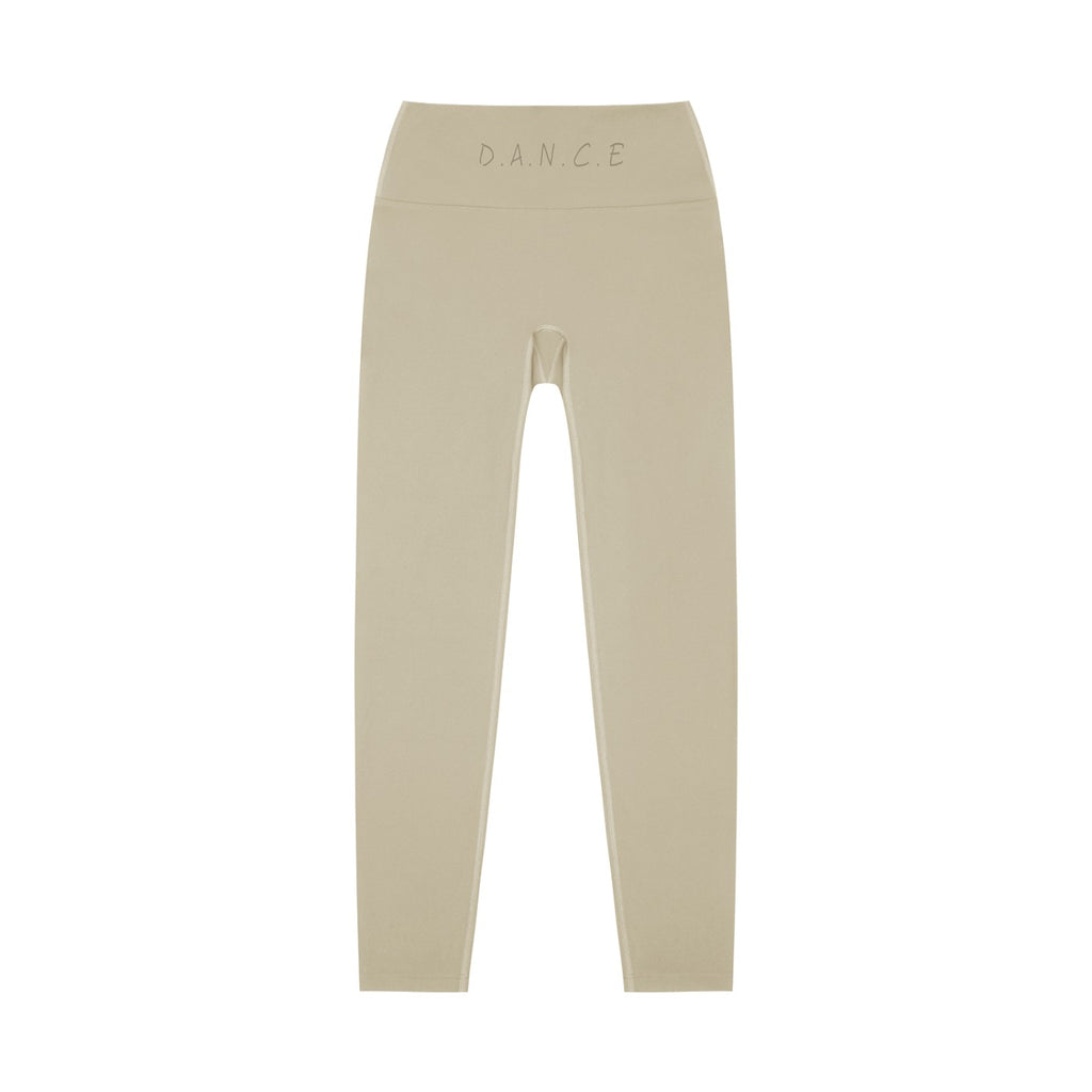 MONROE STORE high-waisted beige yoga leggings with D.A.N.C.E. logo on waistband, made from a stretchy fabric.