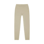 MONROE STORE high-waisted beige yoga leggings with D.A.N.C.E. logo on waistband, made from a stretchy fabric.