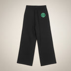 MONROE STORE black fleece drawstring sweatpants with a green embroidered logo patch on the back pocket.