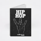 MONROE STORE black spiral notebook featuring a white hand gesture graphic and Hip Hop text on the cover.