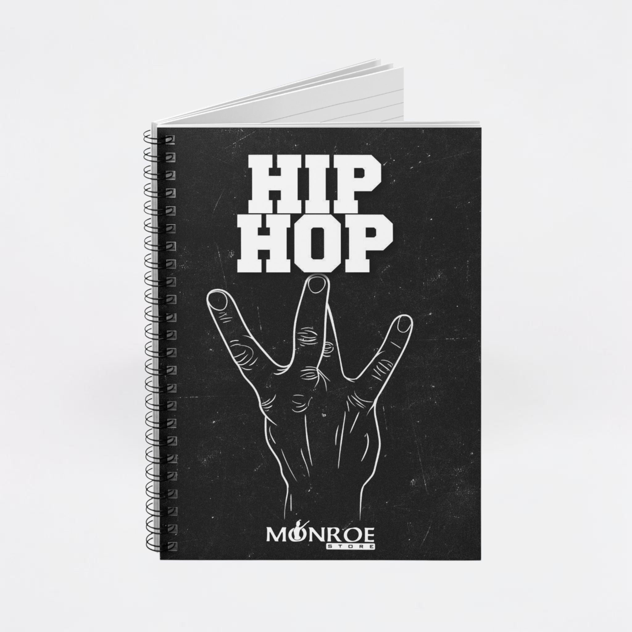 MONROE STORE black spiral notebook featuring a white hand gesture graphic and Hip Hop text on the cover.