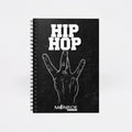 MONROE STORE black spiral notebook featuring a white Hip Hop graphic and hand gesture design on the cover.