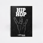 MONROE STORE black spiral notebook featuring a white Hip Hop graphic and hand gesture design on the cover.