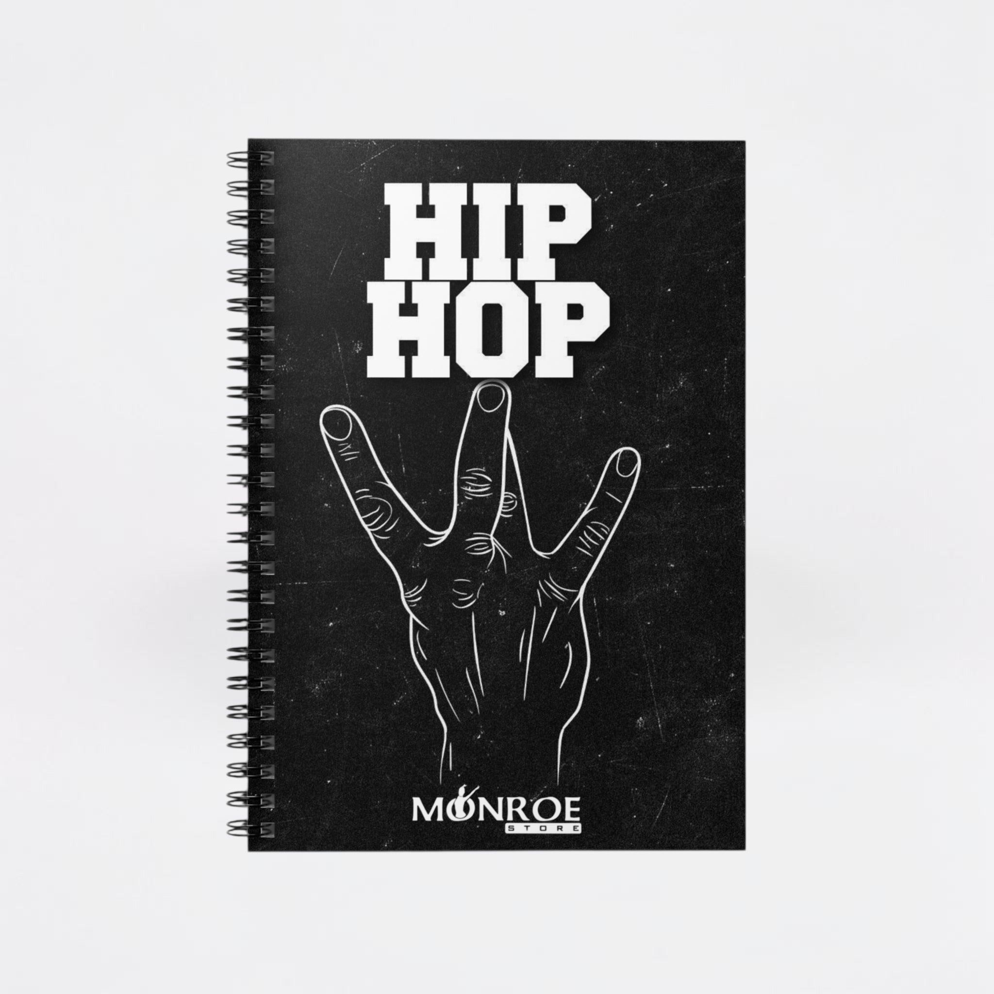 MONROE STORE black spiral notebook featuring a white Hip Hop graphic and hand gesture design on the cover.