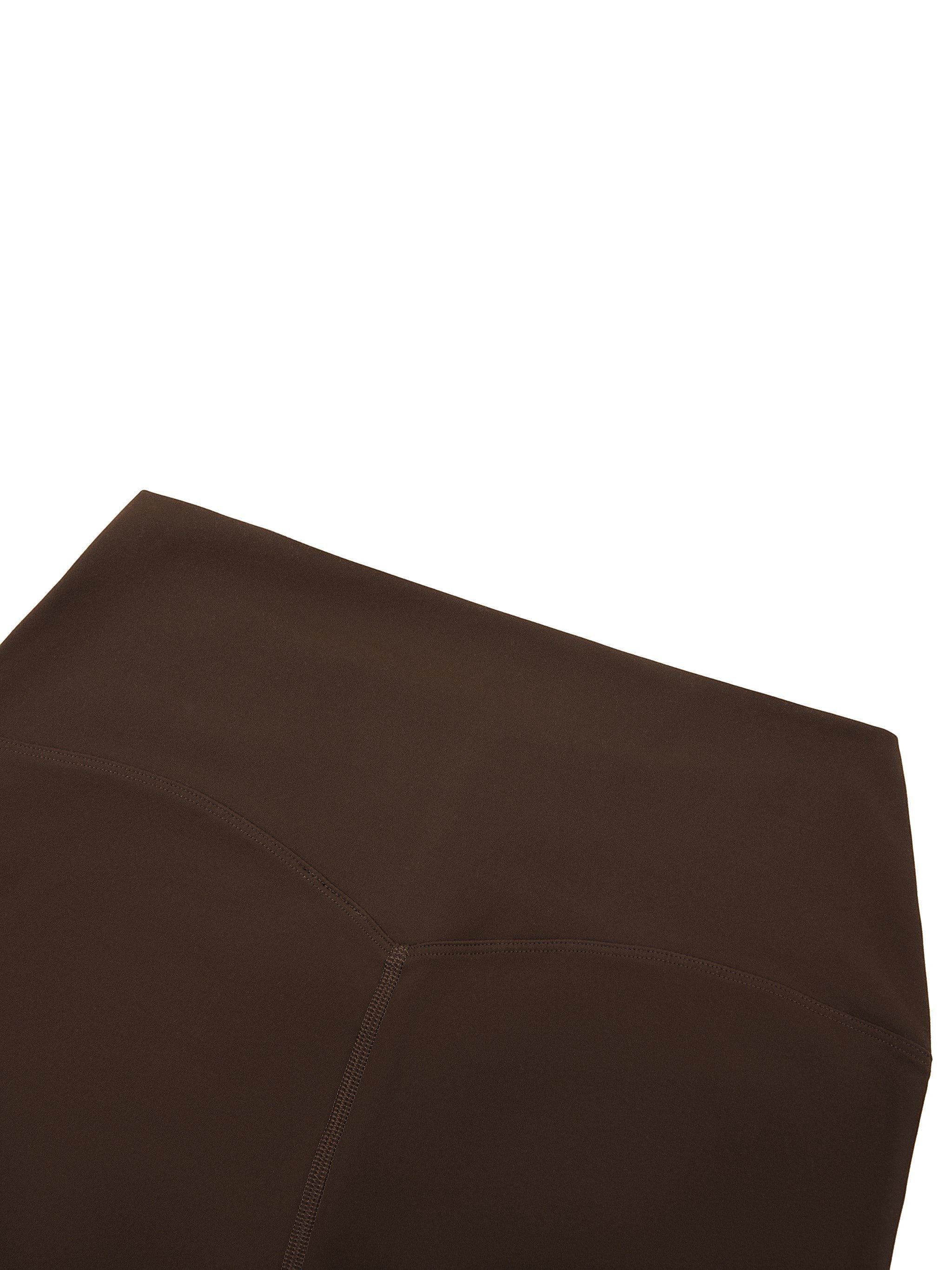 MONROE STORE dark brown high-waisted yoga leggings with a skinny fit and visible stitching details.
