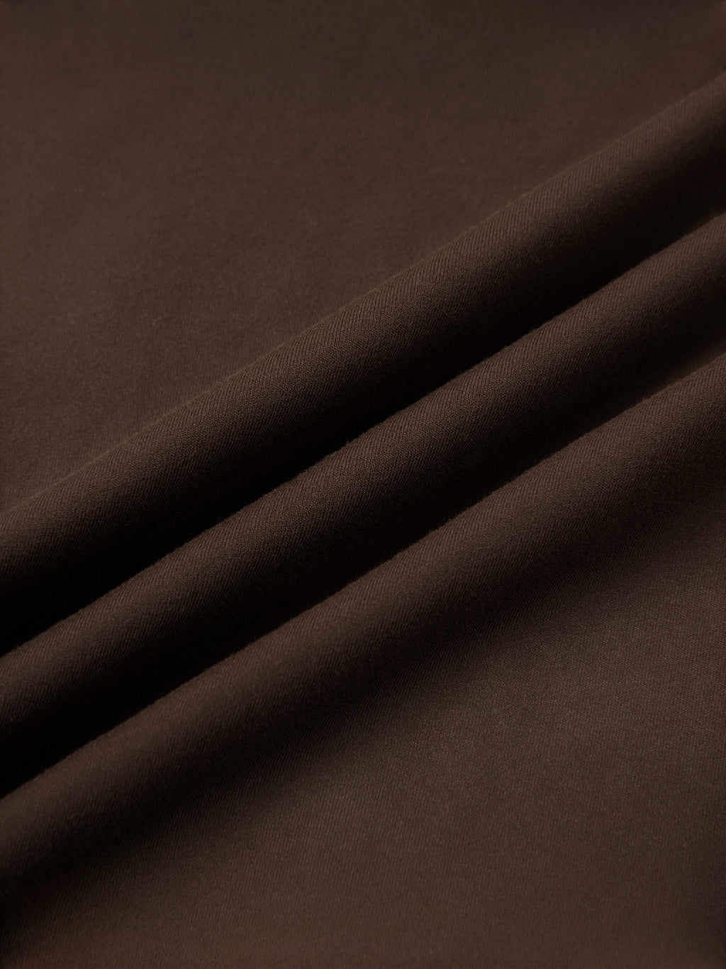 MONROE STORE high-waisted yoga leggings in dark brown, made from a stretchy, opaque fabric.
