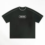 MONROE STORE camiseta negra de algodón 100% unisex con cuello redondo y ribete blanco, manga corta y detalle de cinta contrastada.