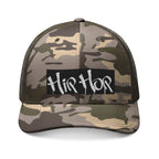 MONROE STORE Camouflage trucker hat with "Hip Hop" graphic on a black patch. Cotton front, mesh back.