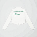MONROE STORE chaqueta de yoga blanca de manga larga con cremallera completa y ajuste ceñido, con logo verde en la espalda y detalle acanalado en la cintura.