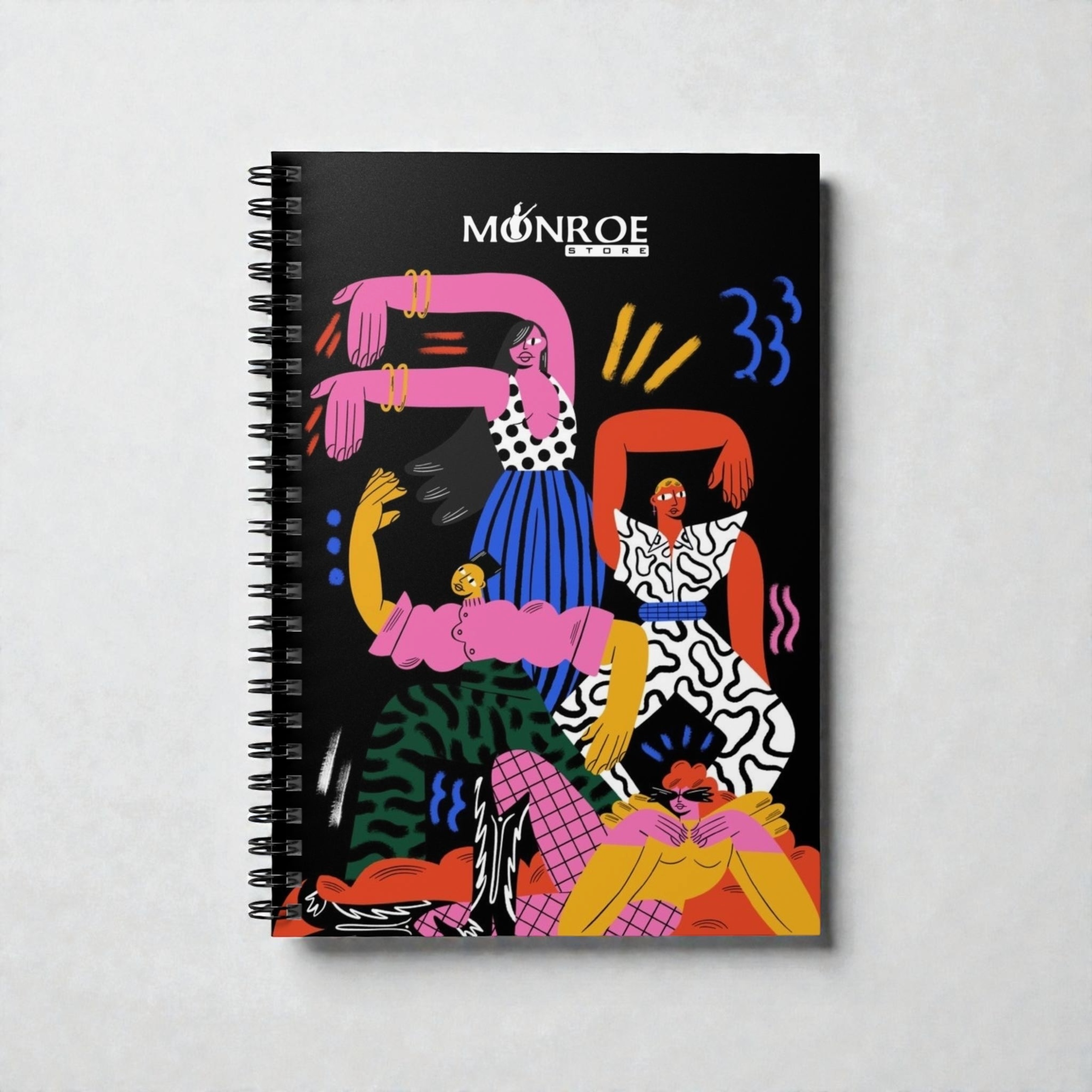 MONROE STORE cuaderno con espiral, cubierta negra con diseño abstracto de figuras coloridas y vibrantes, ideal para artistas y escritores.
