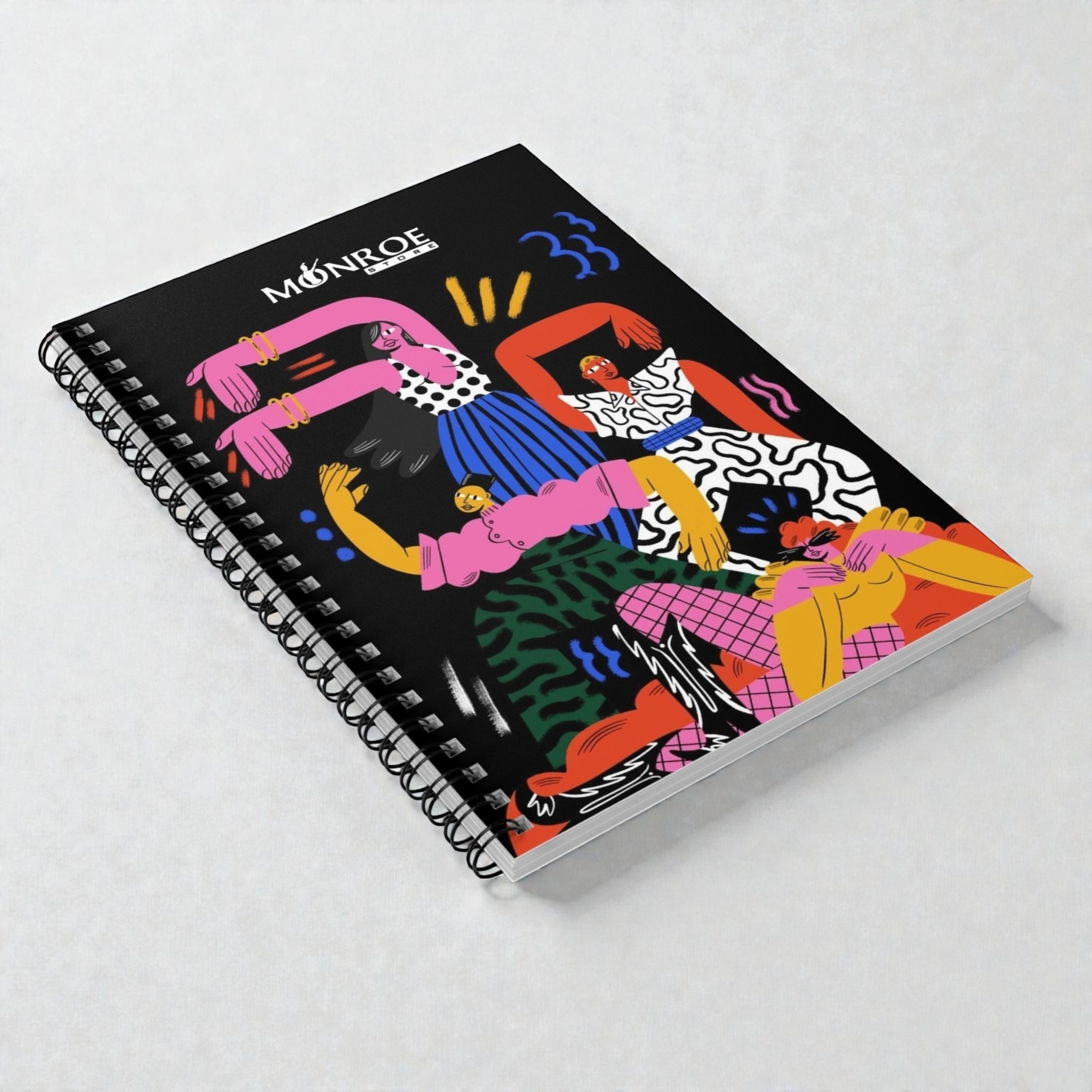MONROE STORE cuaderno de espiral con diseño de figuras coloridas y vibrantes sobre fondo negro, ideal para artistas y escritores.