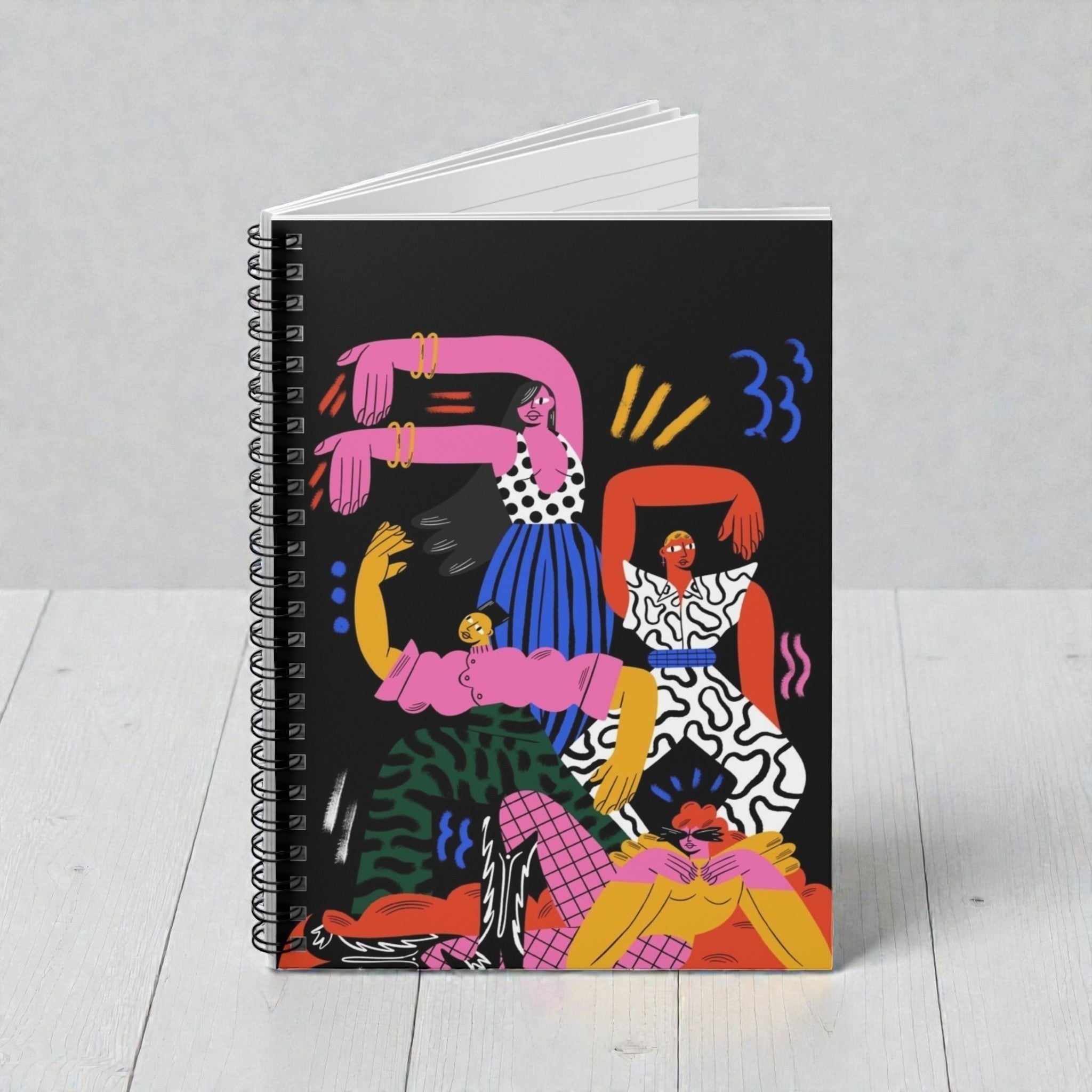 MONROE STORE Cuaderno de espiral con diseño abstracto de figuras en negro, rosa, amarillo, azul y verde. Tapa dura y páginas rayadas.