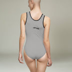 MONROE STORE grey one-piece swimsuit with black trim, U-shaped neckline, and inner chest support. Made of polyester and spandex.