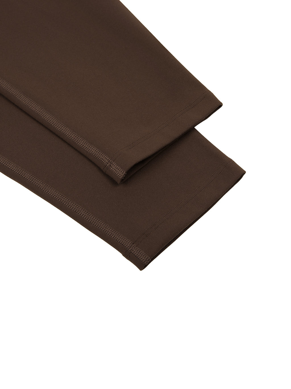 MONROE STORE high-waisted yoga leggings in dark brown, made from a stretchy fabric with flatlock seams.