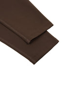 MONROE STORE high-waisted yoga leggings in dark brown, made from a stretchy fabric with flatlock seams.