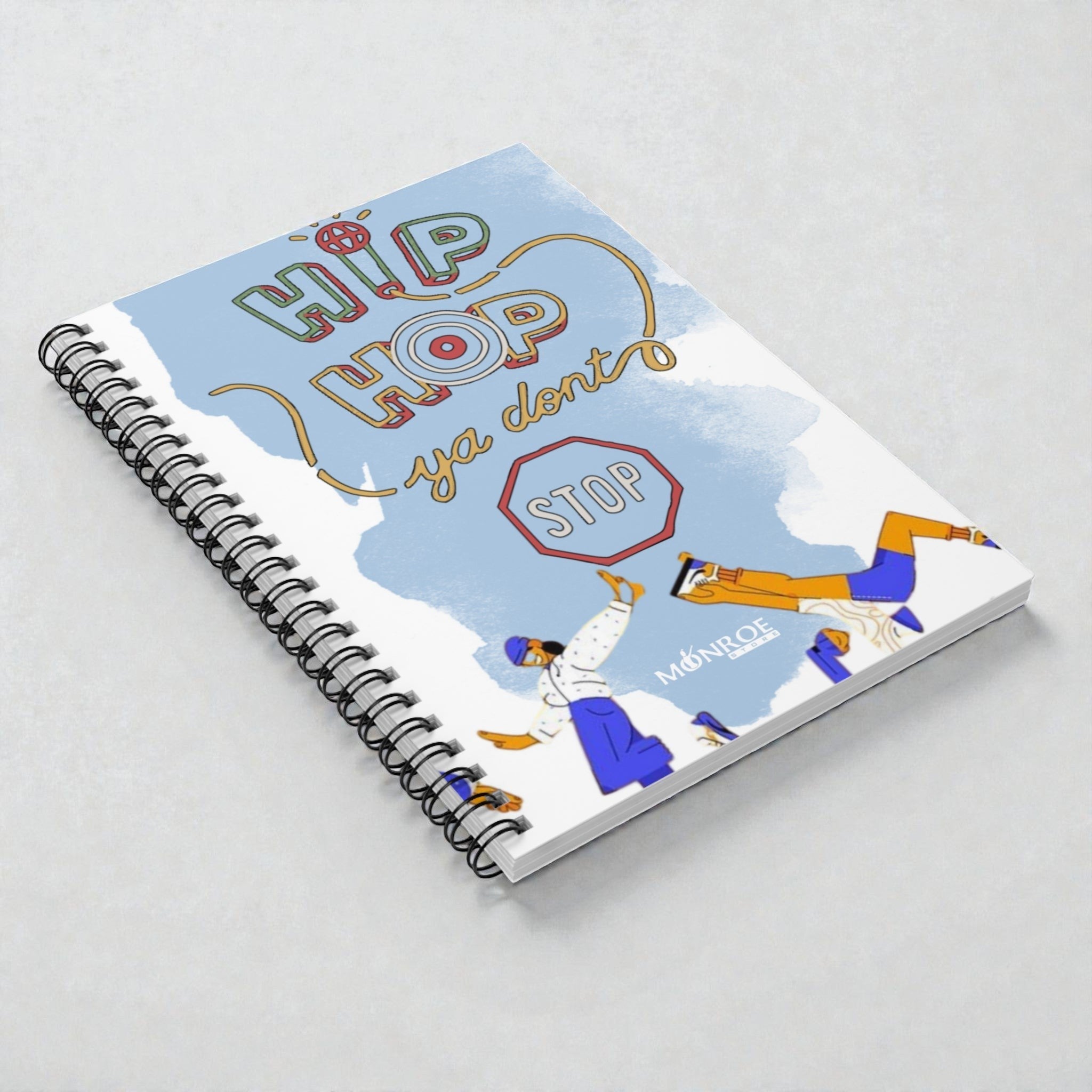 MONROE STORE Hip Hop themed spiral notebook with a blue sky background, featuring colorful text and illustrations of people dancing.
