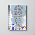 MONROE STORE hip hop themed spiral notebook with colorful lettering and figures dancing. 6x8 inches, 118 pages.