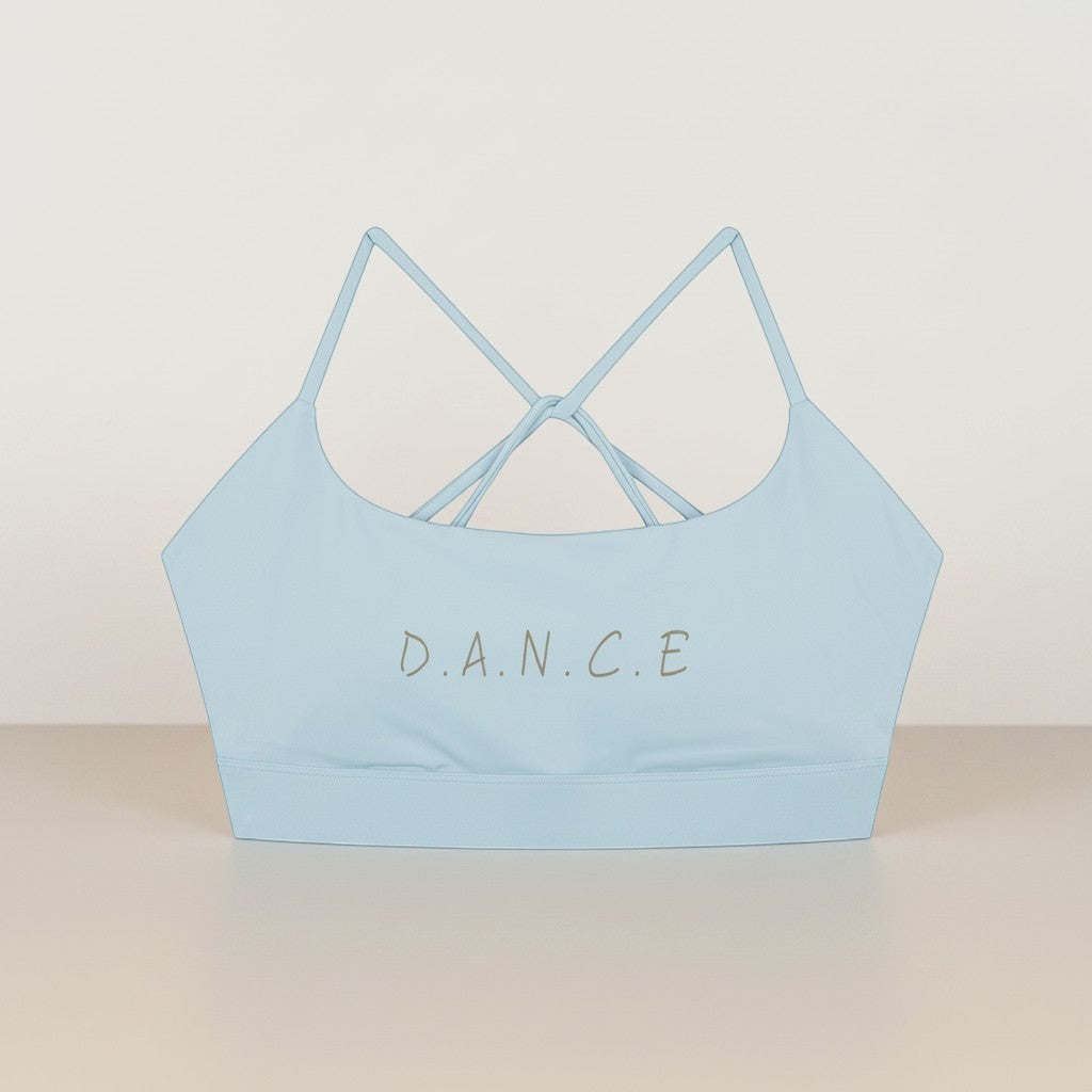 MONROE STORE light blue strappy criss cross back sports bra with 'D.A.N.C.E.' text detail.