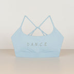MONROE STORE light blue strappy criss cross back sports bra with 'D.A.N.C.E.' text detail.