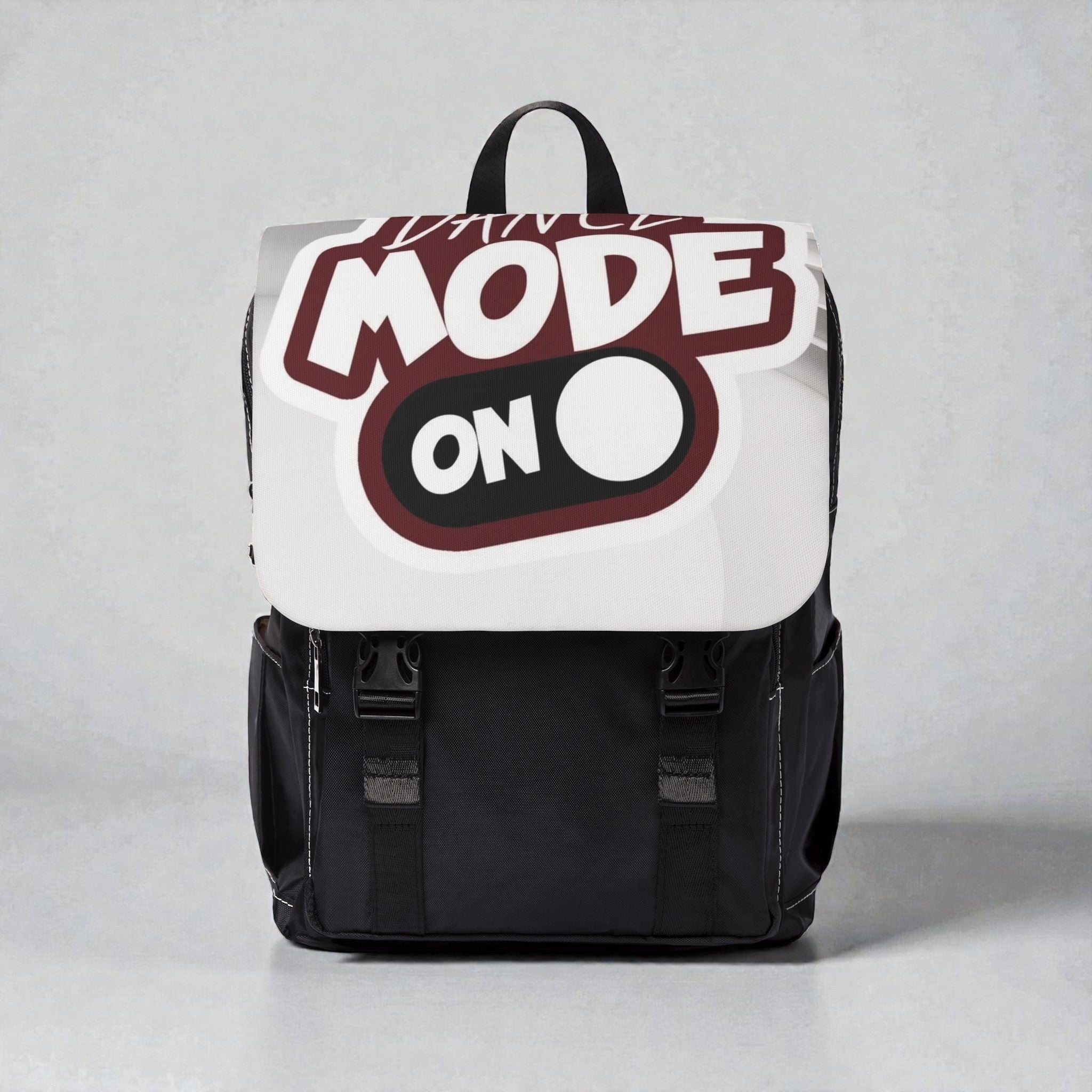 Mochila MONROE STORE negra de lona con diseño divertido "Dance Mode On" y cierre de solapa.