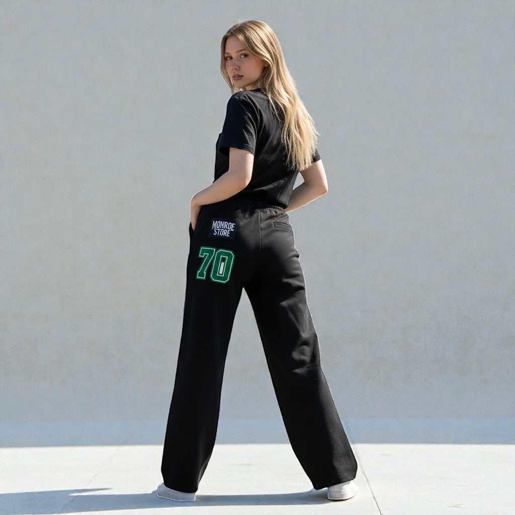 MONROE STORE pantalones de chándal negros de pierna ancha con cordón y número 70 verde en la parte trasera, 80% algodón.