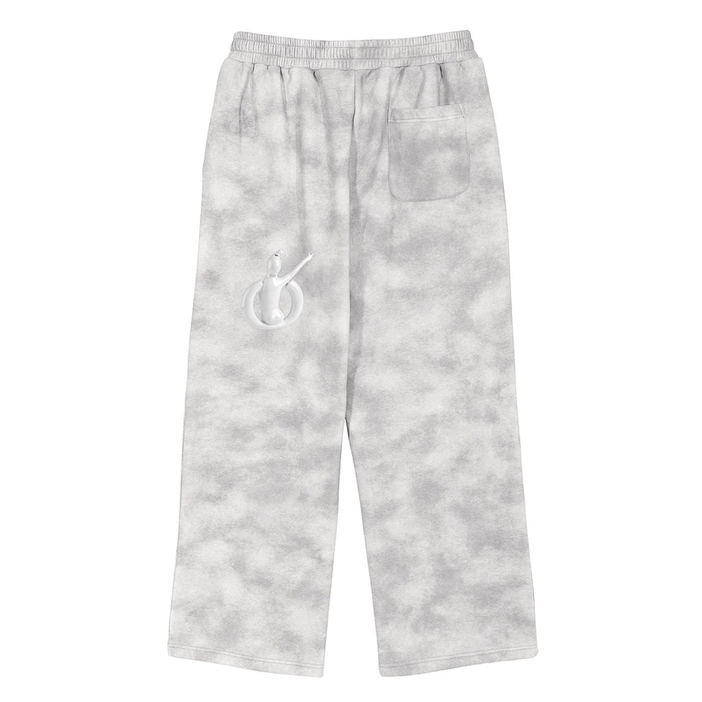 Pantalones deportivos MONROE STORE de corte holgado en gris con efecto lavado y emblema gráfico en la parte trasera.