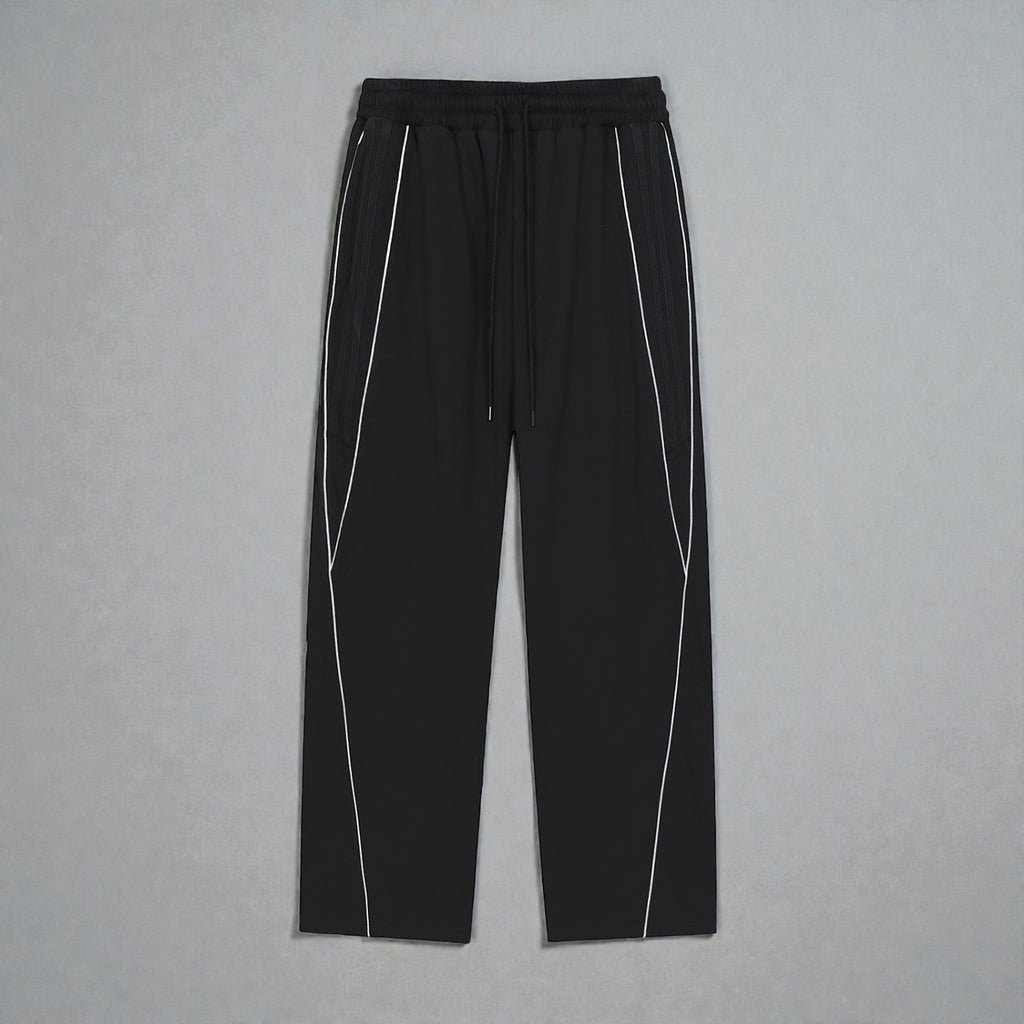 MONROE STORE Pantalones deportivos negros de pierna recta con cordón y detalles de rayas blancas reflectantes.