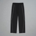 MONROE STORE Pantalones deportivos negros de pierna recta con cordón y detalles de rayas blancas reflectantes.