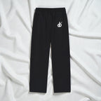 MONROE STORE Pantalones negros de algodón y poliéster con cordón y logo blanco bordado en el bolsillo trasero.