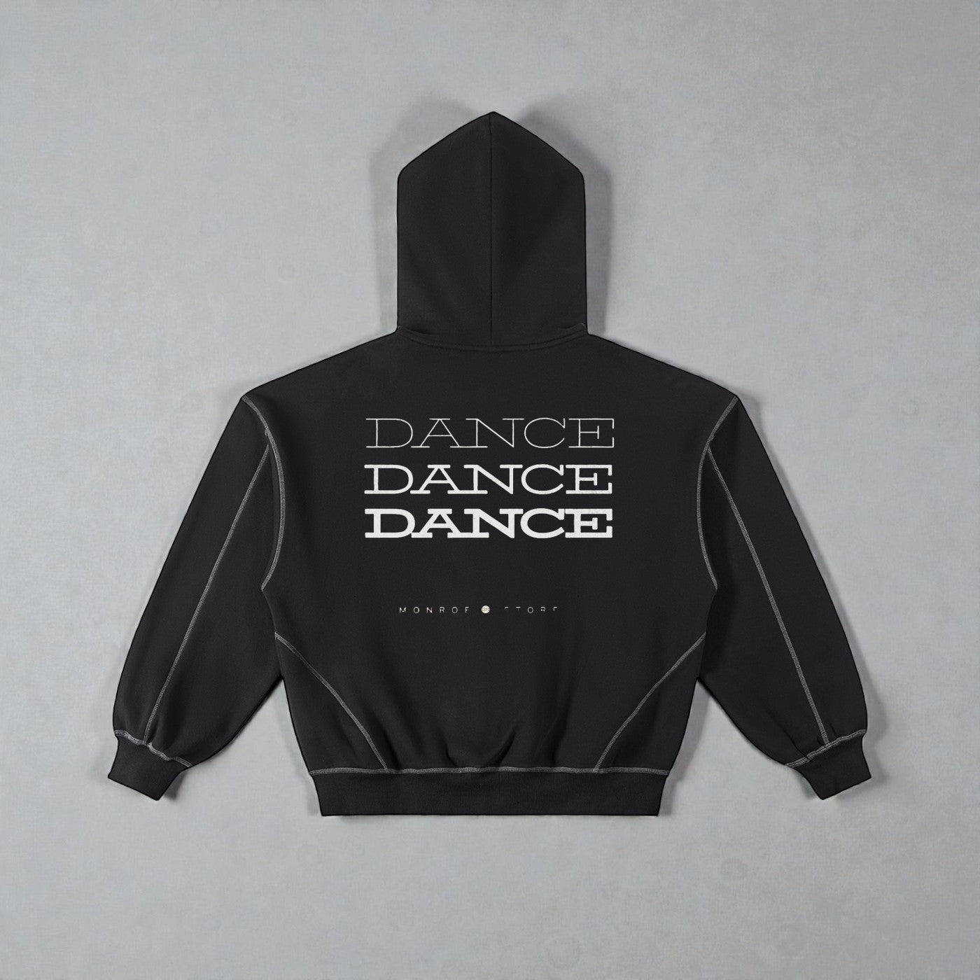 MONROE STORE sudadera negra con capucha y cremallera, con texto "DANCE" repetido y costuras de contraste.