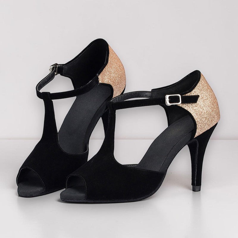 Zapatos de baile latino MONROE STORE negros de ante con tacón de aguja, puntera abierta y detalle de purpurina dorada.